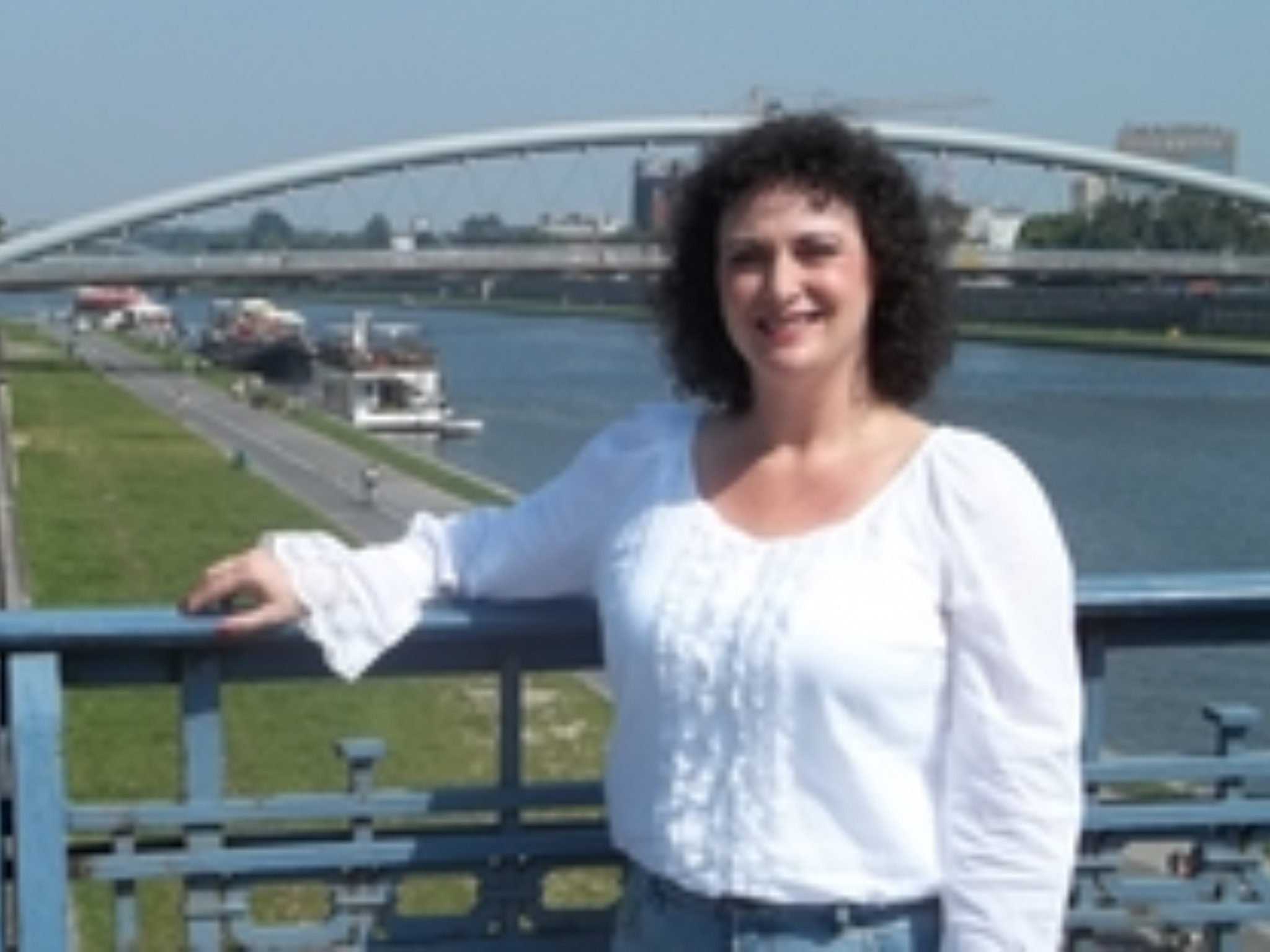 I am standing on a bridge which is in front of the newly constructed Slashi bridge, for walking civilians only. It was on this bridge that my father watched as the Nazis marched across it to meet with the then Krakow Mayor, who welcomed them. The bridge is named Slashi, pronounced "Shaloshki".
